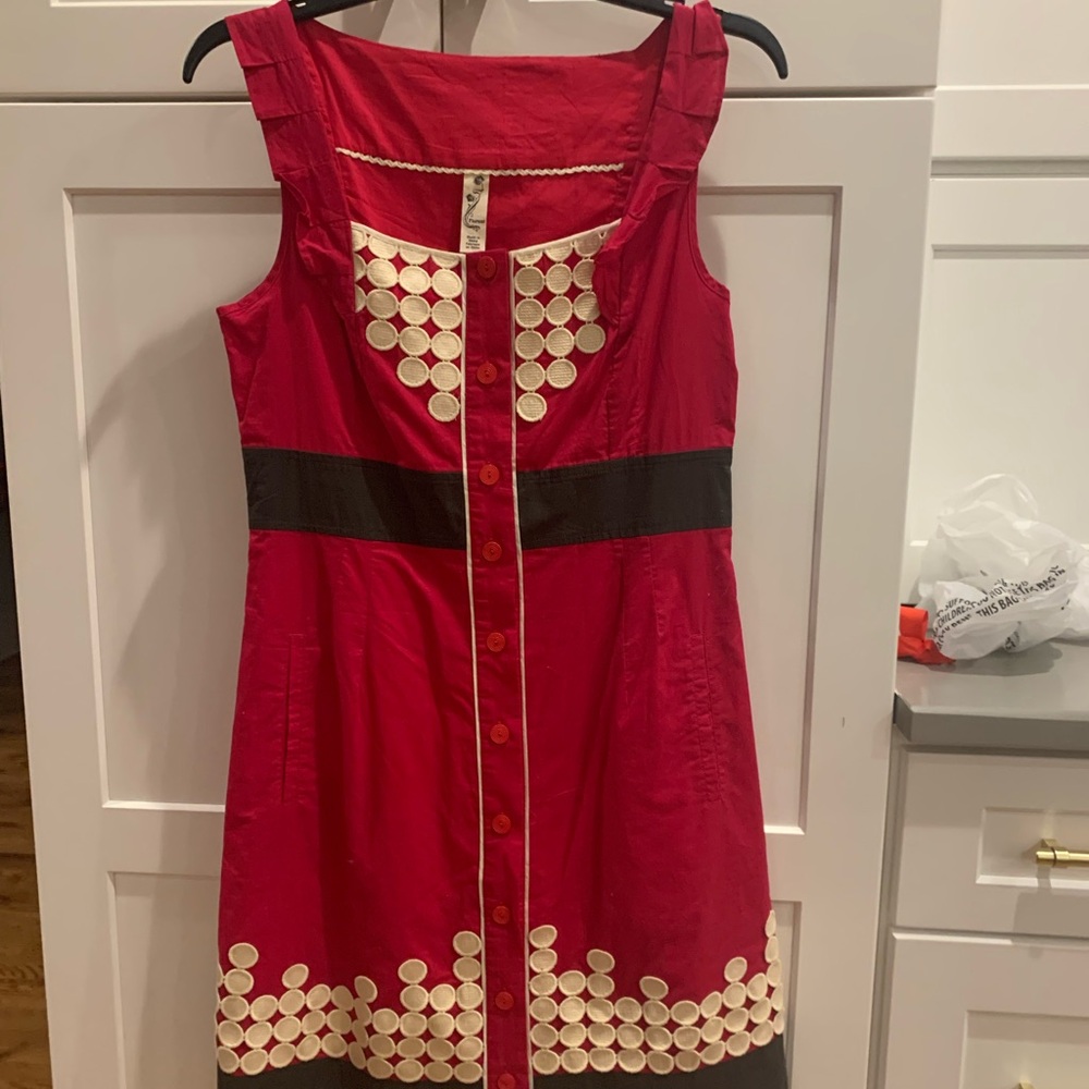 Adorable red dress with black accents and white polka dots.